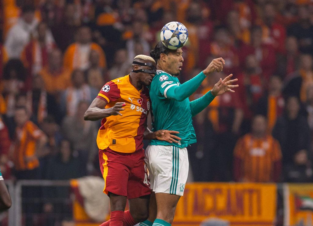 Liverpool captain Virgil van Dijk challenges for a header with Galatasaray's Victor Osimhen during the UEFA Champions League match at RAMS Park