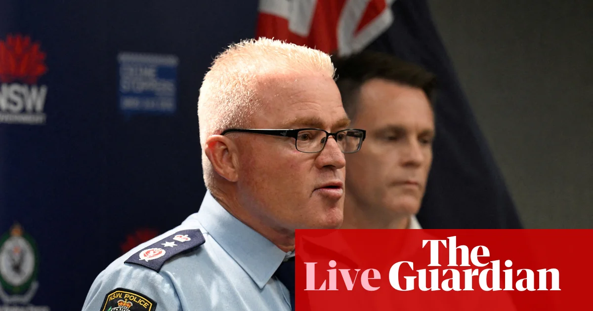 Bondi beach shooting live: alleged gunmen had homemade Isis flags in their car and visited Philippines last month, NSW police commissioner says